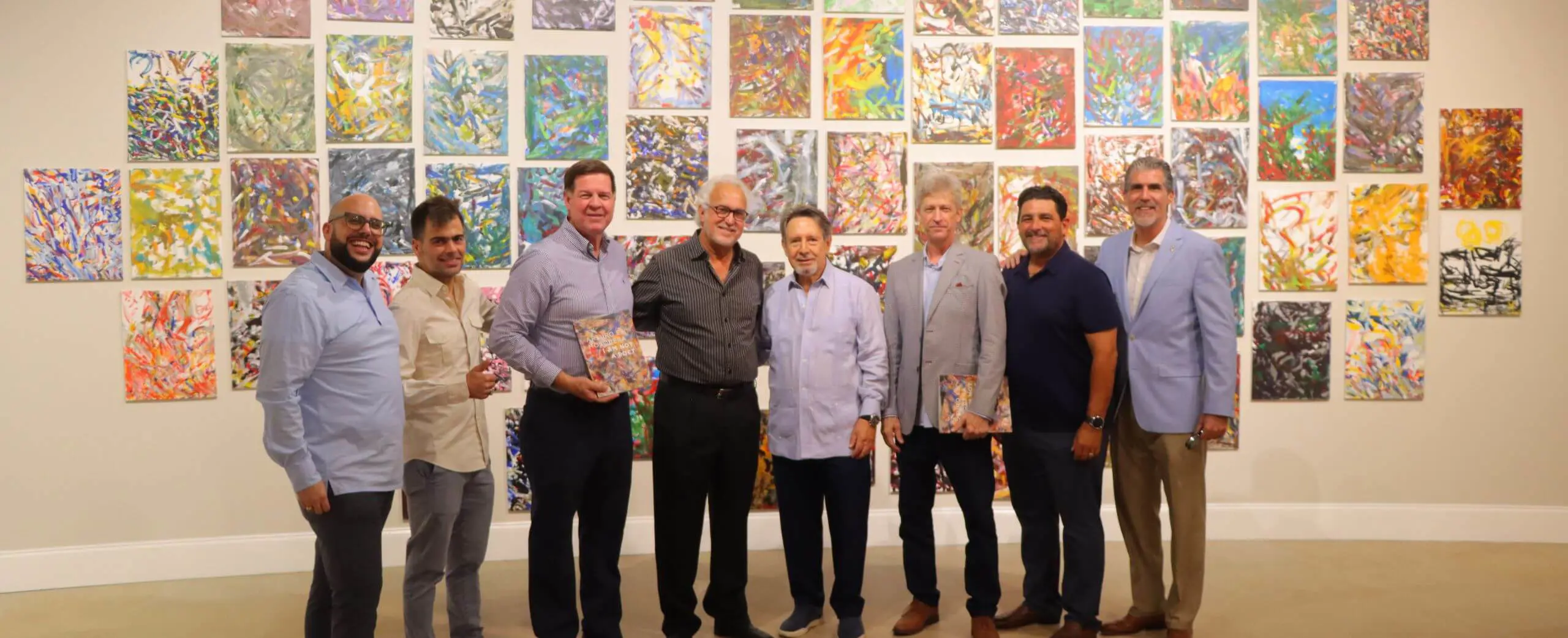 September 2024 group photograph with artworks at the I Am Not A Poet Exhibition Opening Reception