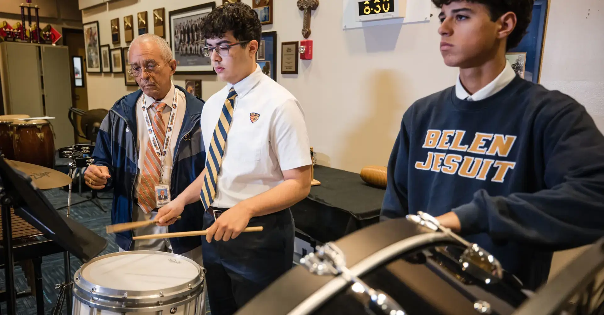 Belen Jesuit students playing percussion in a music class.