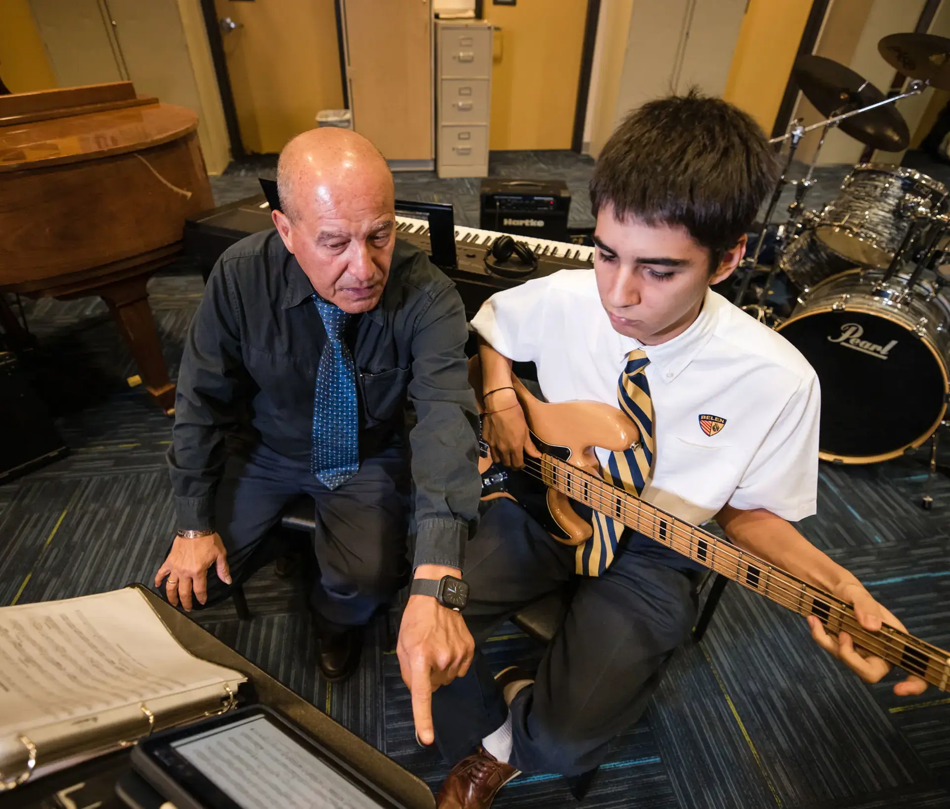 Student having a guitar lesson in the Ignatian Center for the Arts