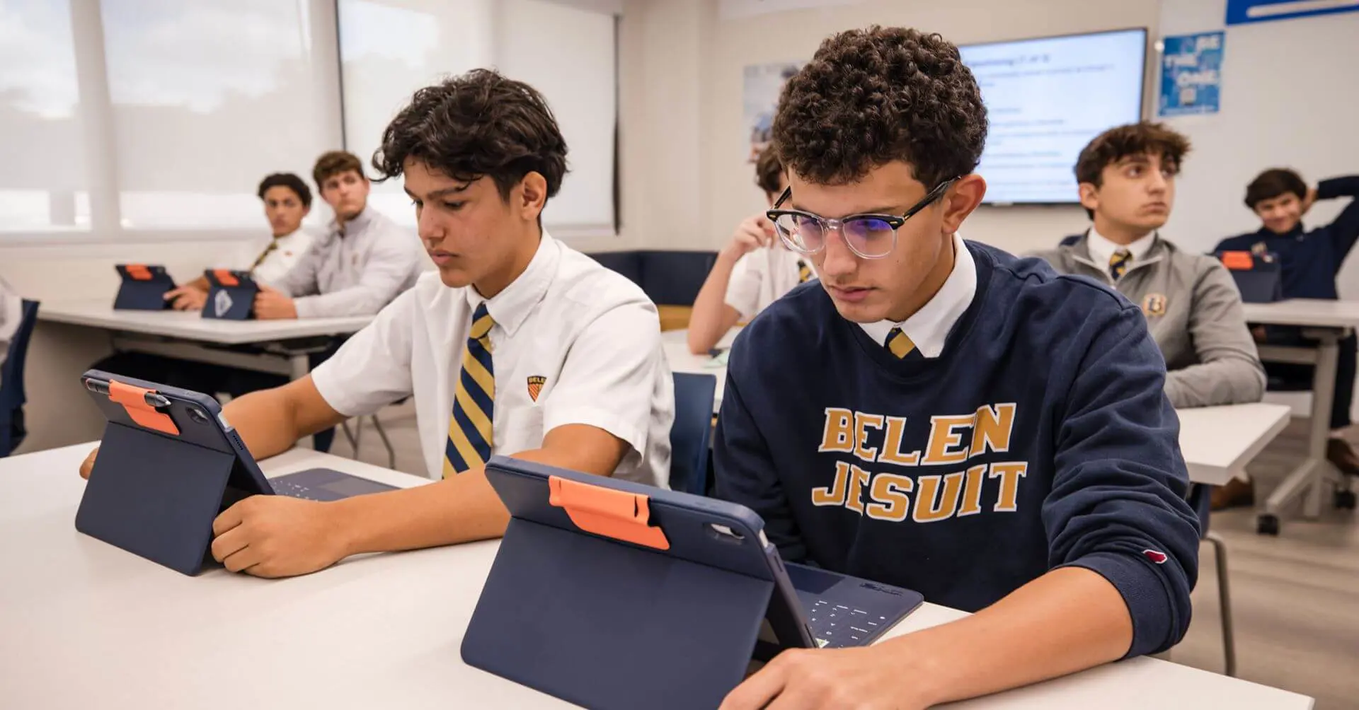 Belen Jesuit students using electronic tablets in a Catholic Entrepreneurship Program class.