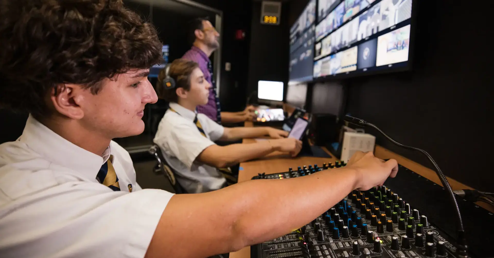 Belen Jesuit students editing footage in the Conde Media Center.