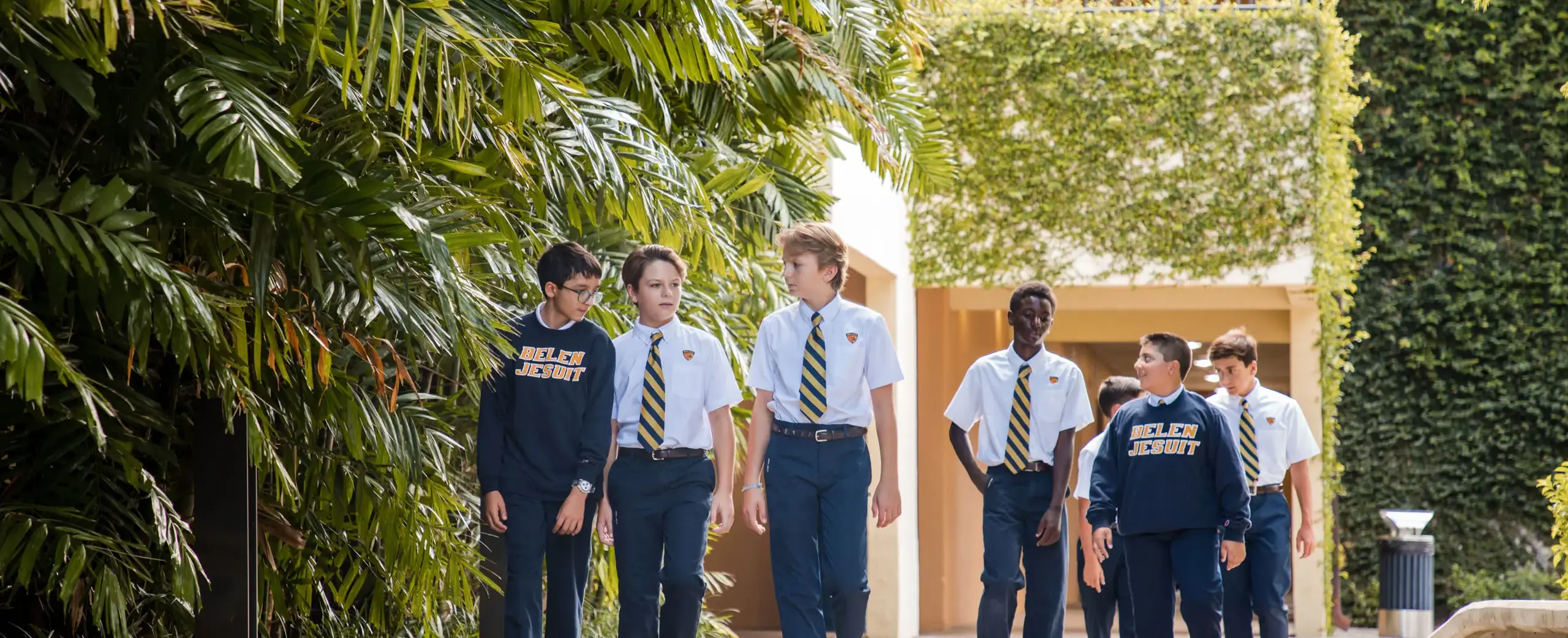 Belen Jesuit students walk across campus together.
