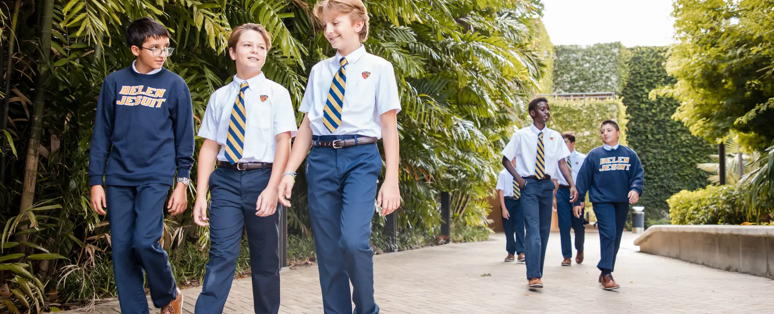 Belen Jesuit students walking across campus together.