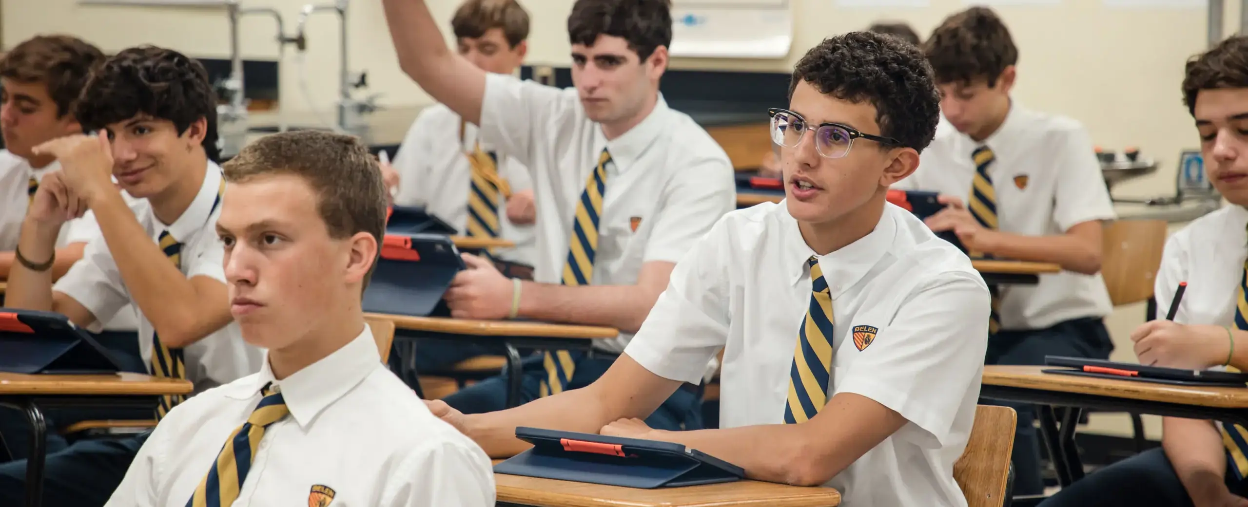 Belen Jesuit students listening attentively in a class.