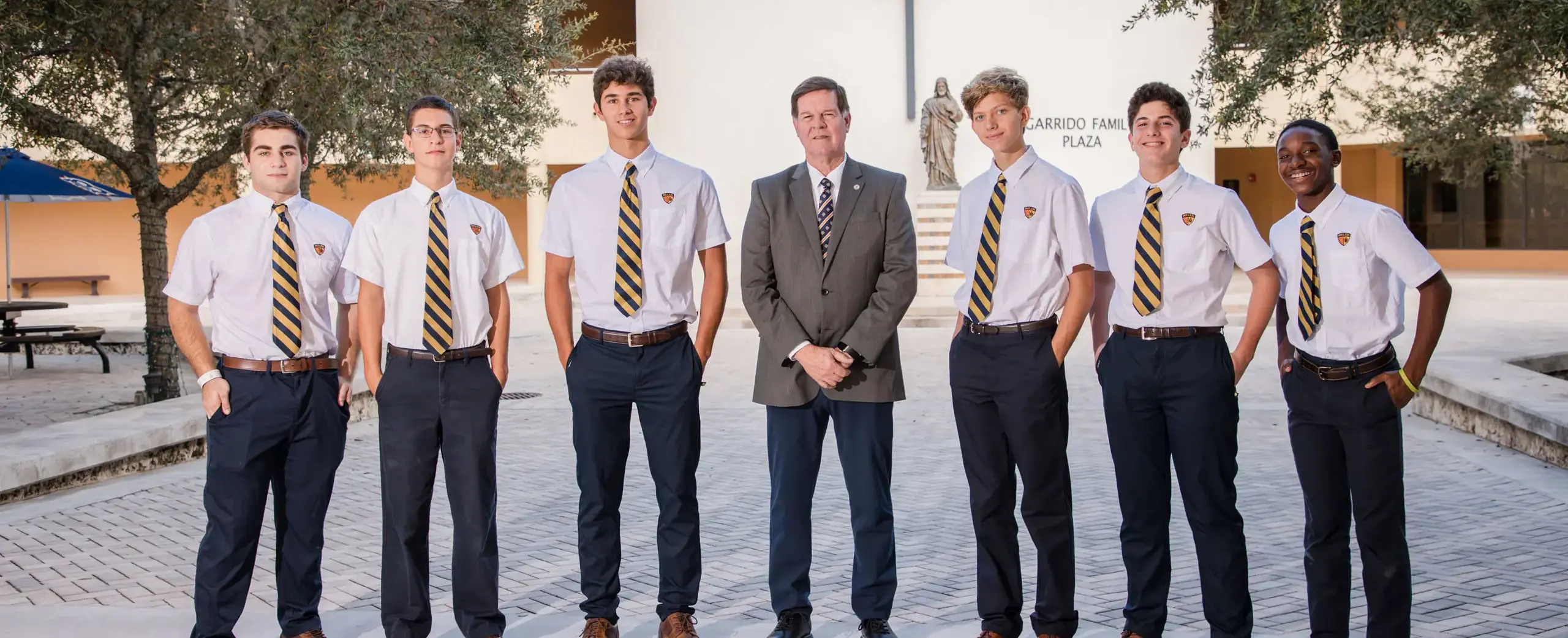 Belen Jesuit students and principal on campus.