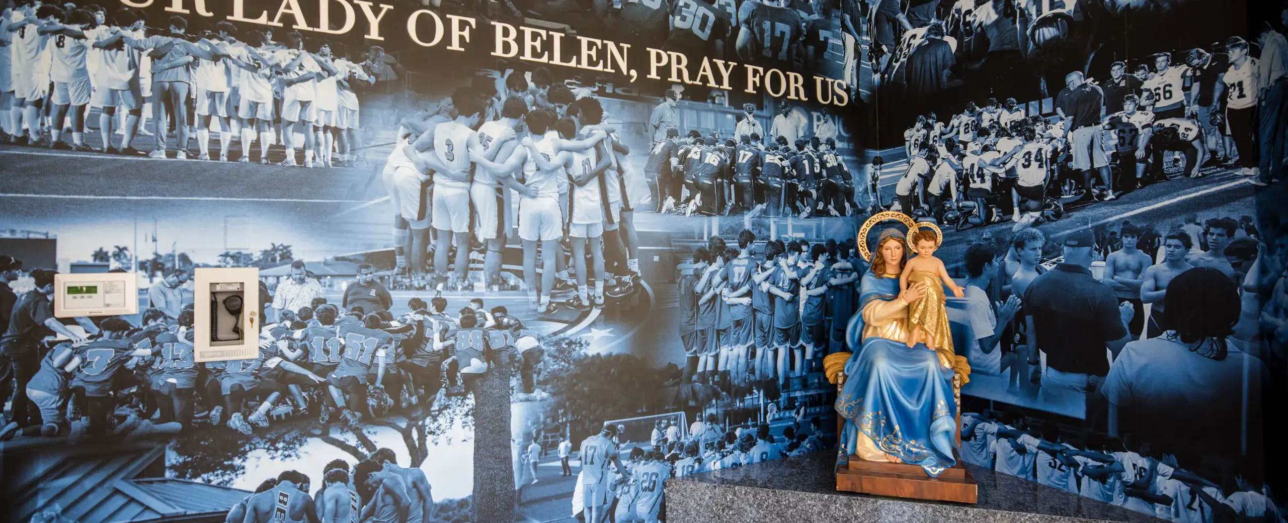 Interior of the Roberto Suris Athletic Center with Madonna and Child sculpture.