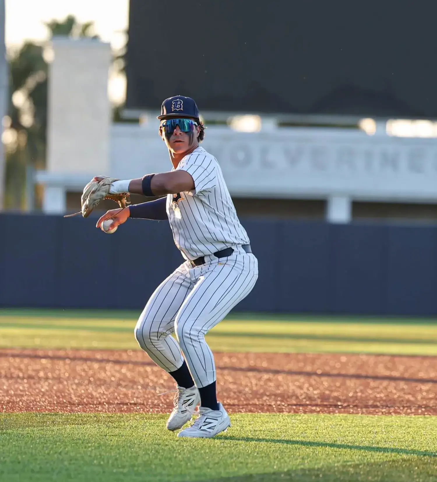Belen Jesuit student playing baseball in Maury Park.
