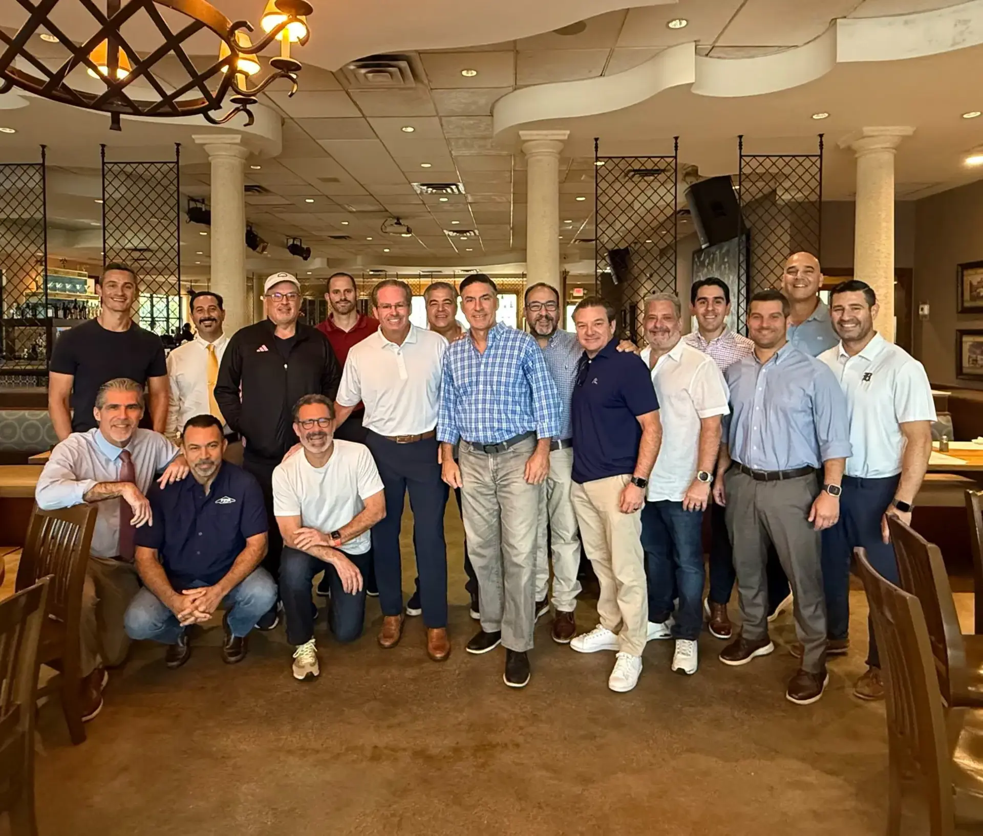 A group of Belen Alumni gather for a networking breakfast and post for a picture.
