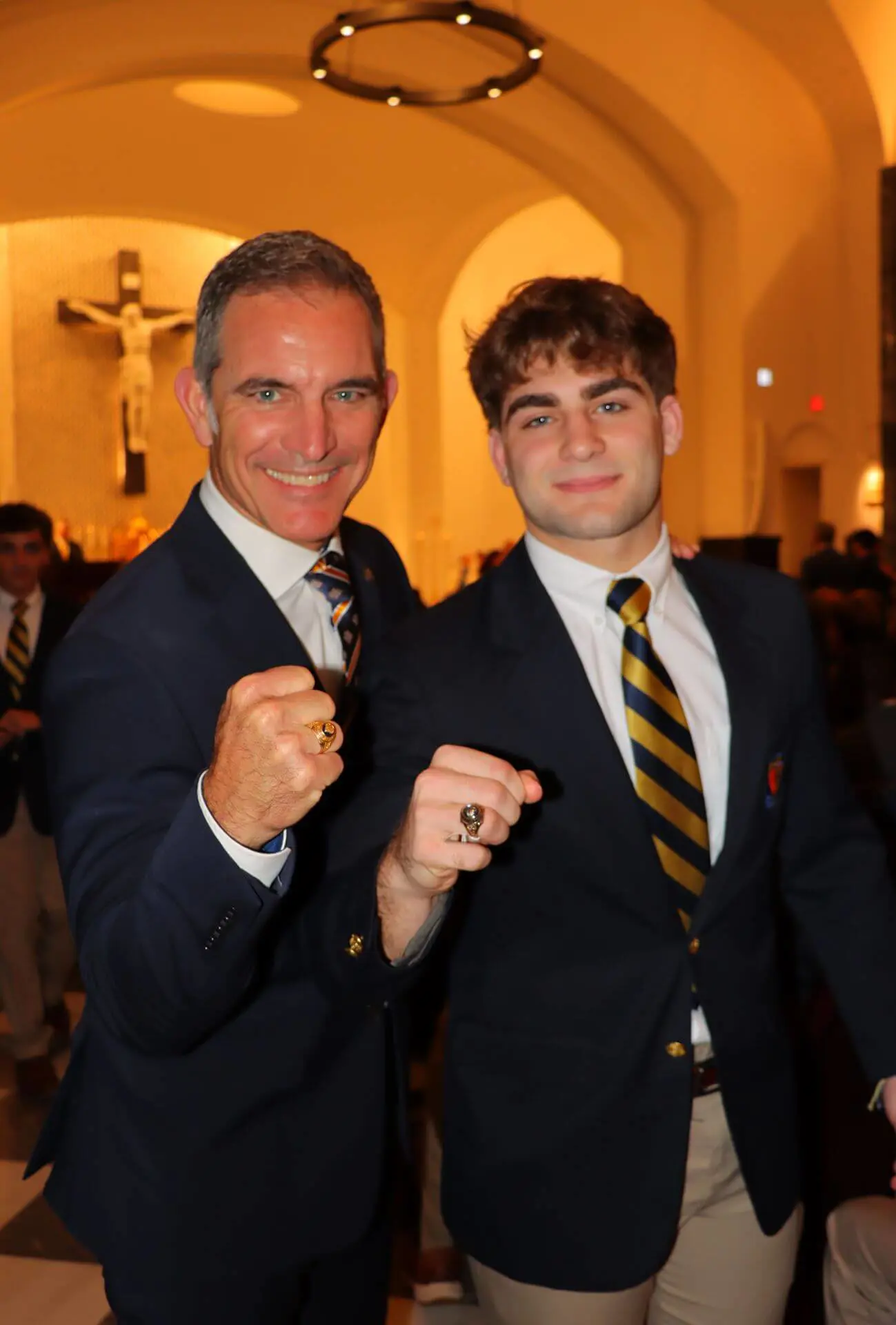 Jose Romano, class of 1988, poses with his son, Jose, class of 2026, after his son received his Belen Jesui class ring. Both proudly show their rings side by side in the Our Lady of Belen Chapel.