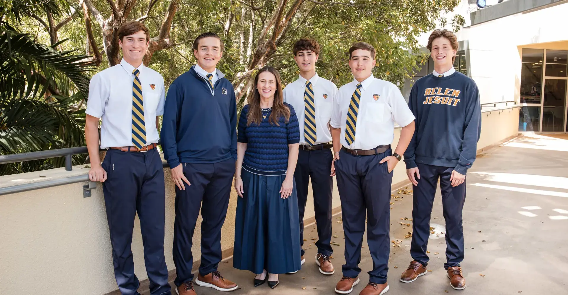 Belen Jesuit High School Students outside on campus with their teacher.