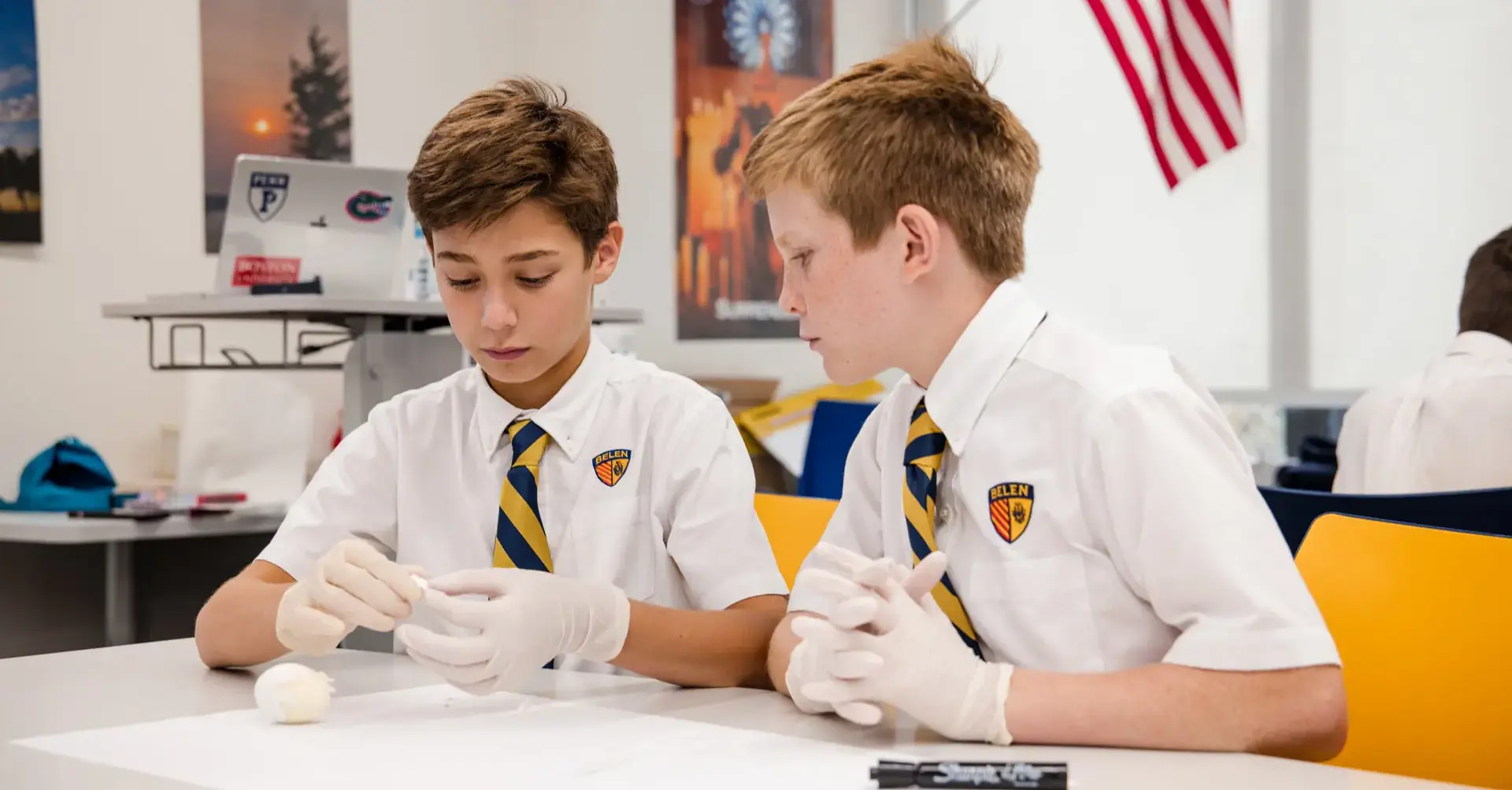Belen Jesuit Middle School students working on an experiment in a science class.
