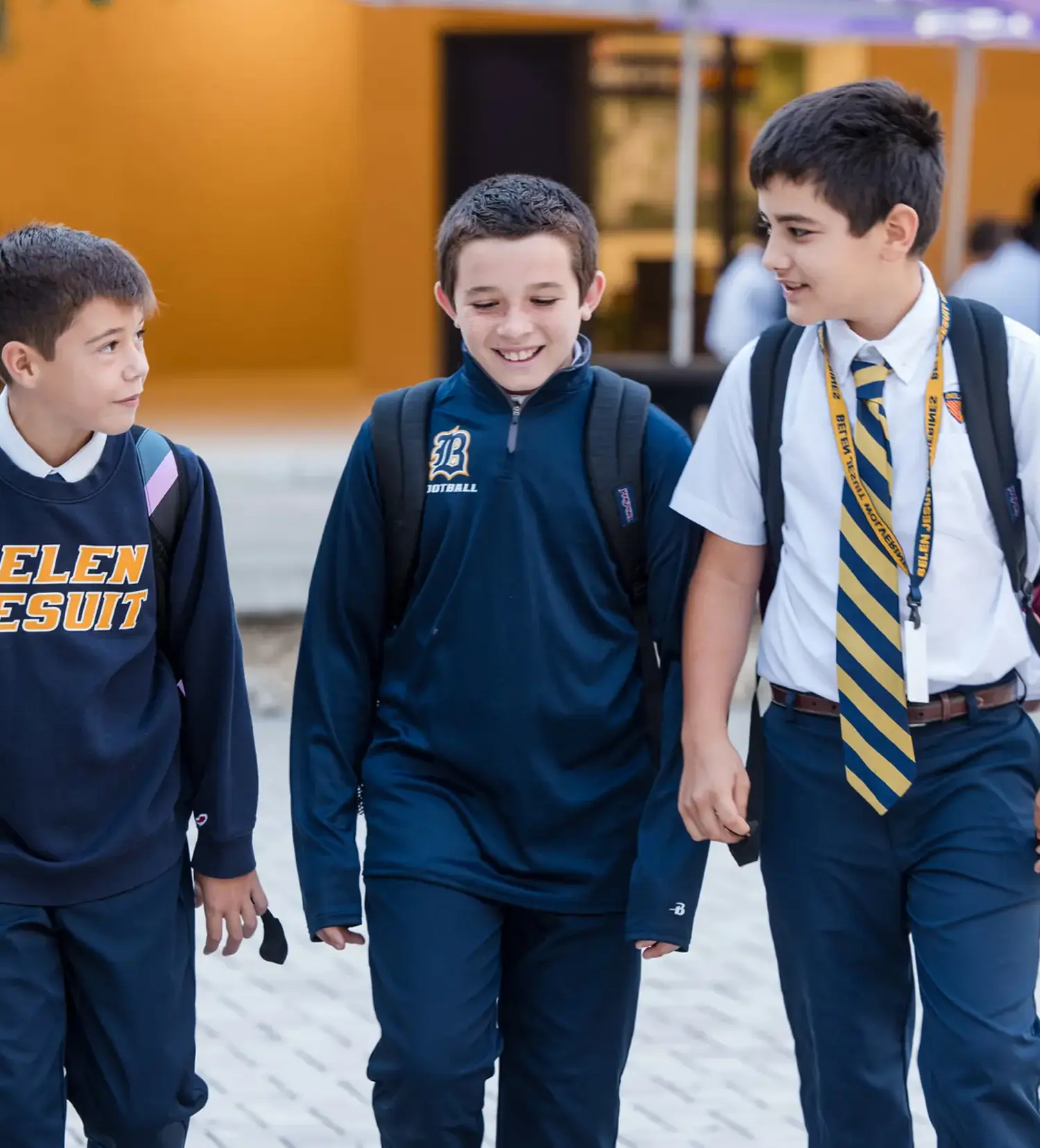 Belen Jesuit Middle School students walking across campus together.
