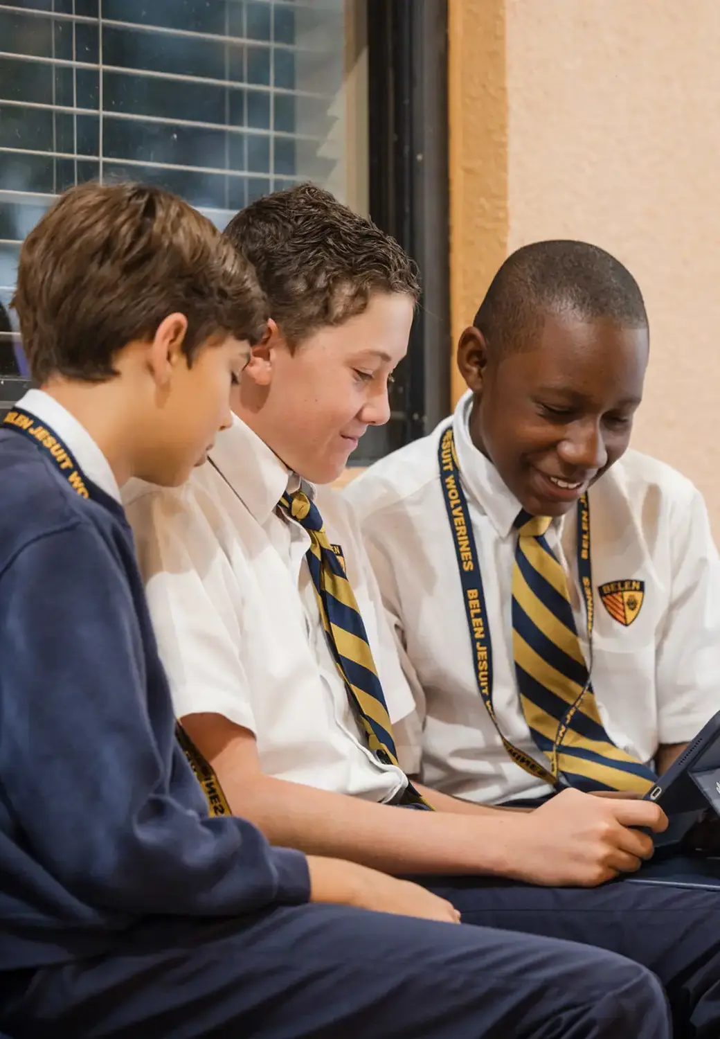 Belen Jesuit students smiling together.