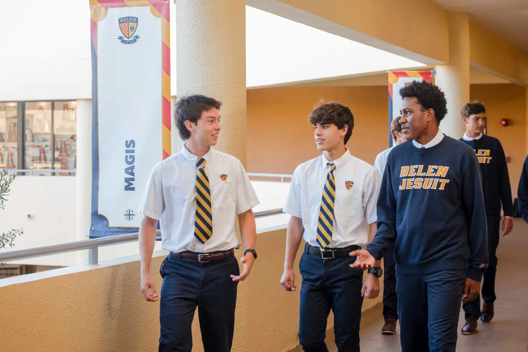 Belen Jesuit High School students walking through the halls together.