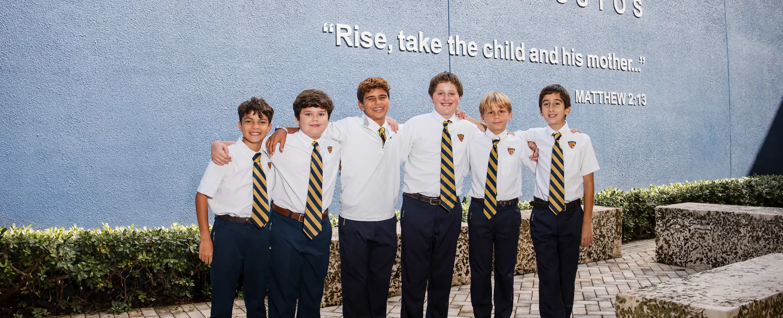 Belen Jesuit students arm in arm.
