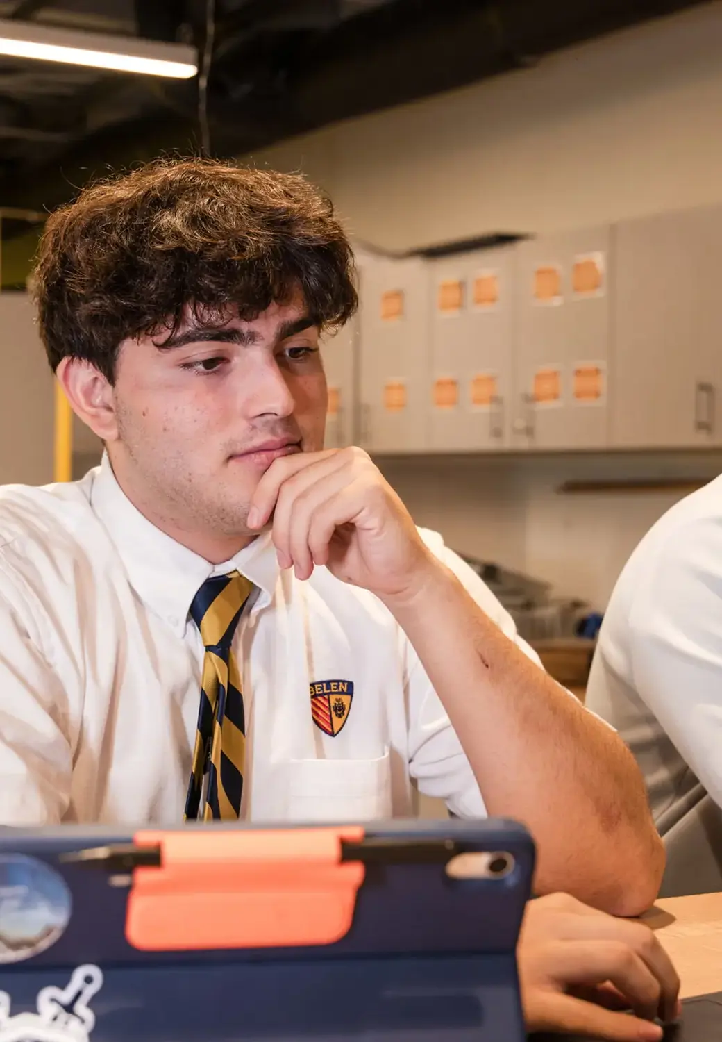 Belen Jesuit student using an iPad in a class.