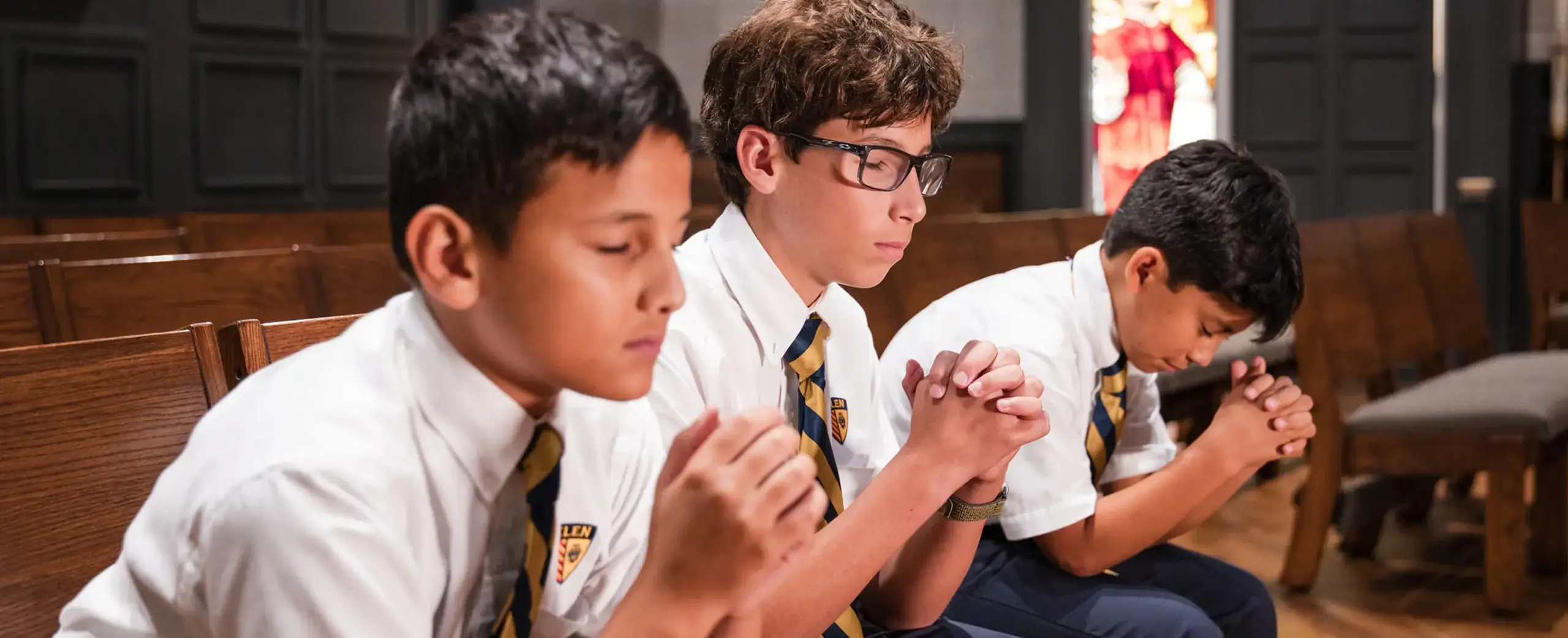 Belen Jesuit students in prayer in the Belen Chapel.