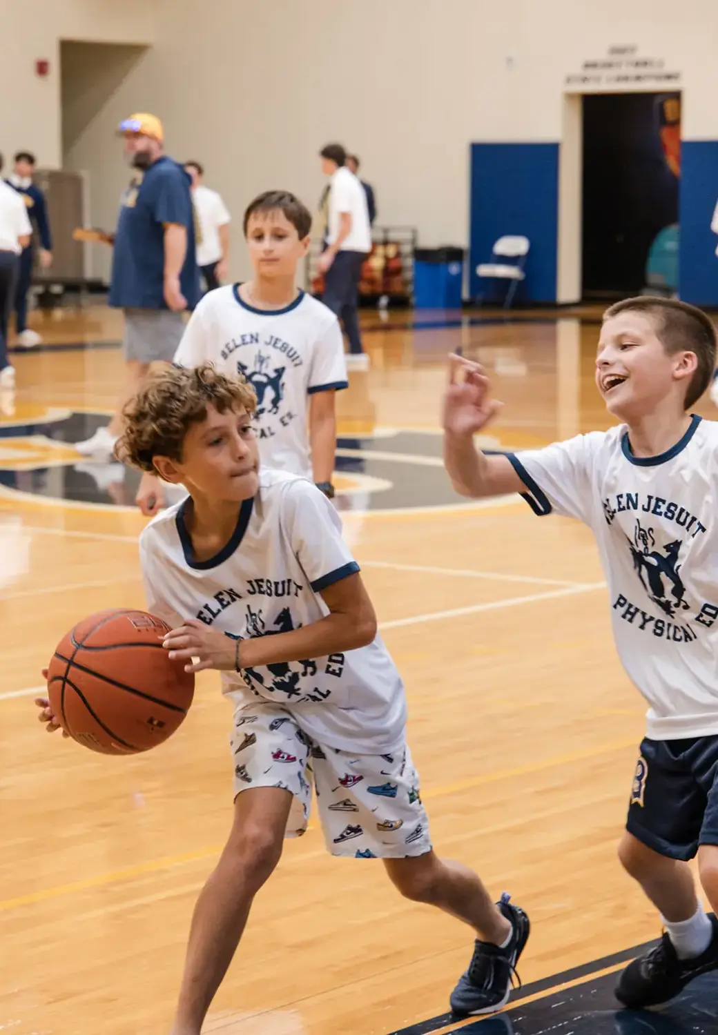 Belen Jesuit Middle School students playing basketball.