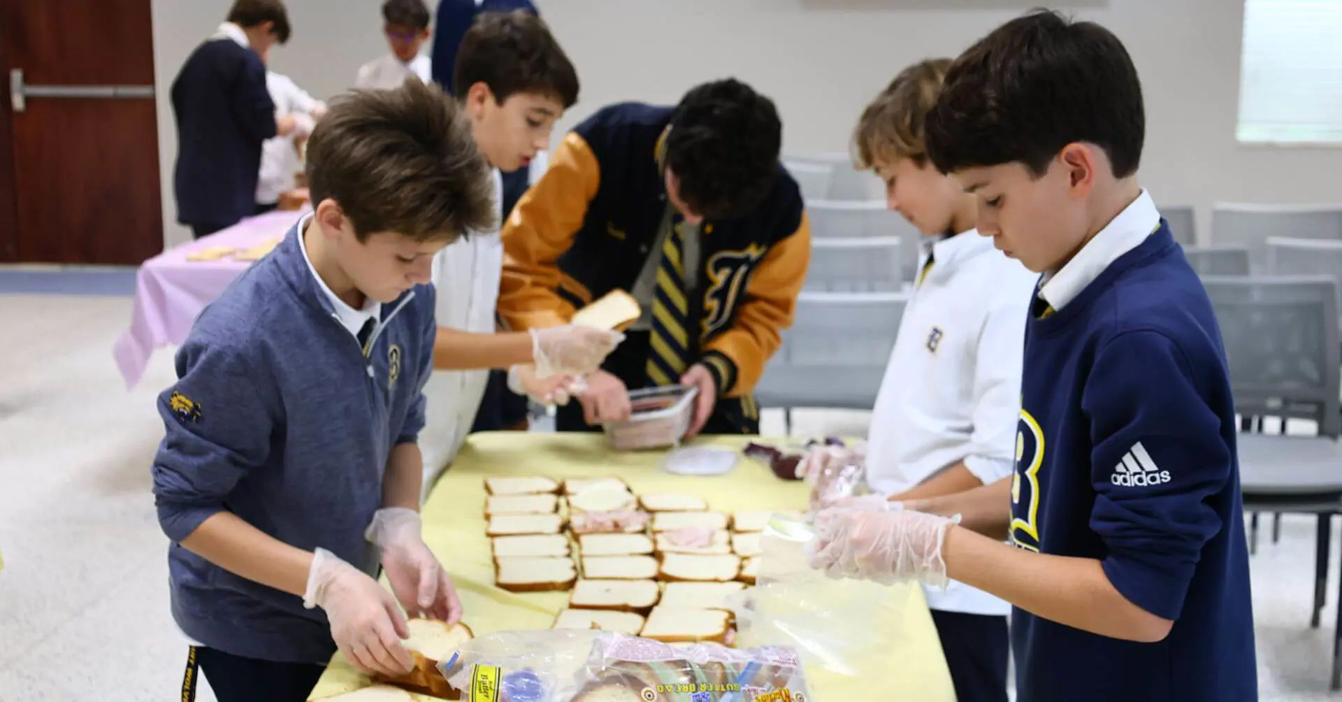 Belen Jesuit Students making sandwiches at Feed the Heart Christian Service event, September 2025.