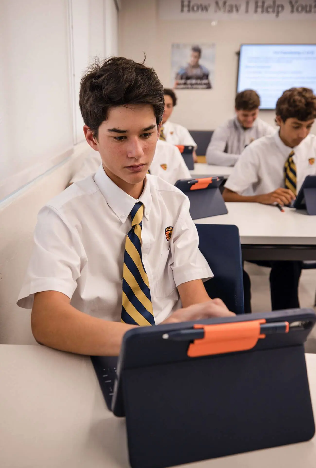 Students working on their iPad in the Catholic Entrepreneurship class.