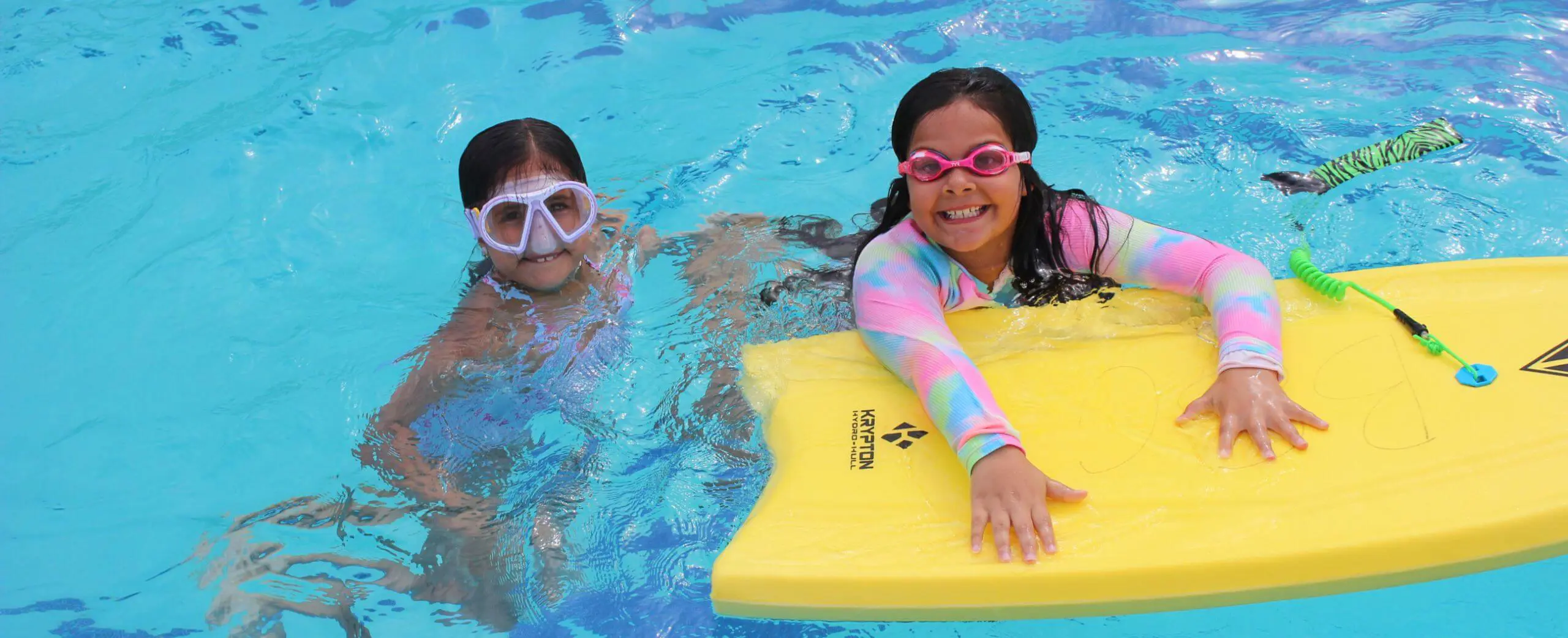 Belen Jesuit Summer Camp attendees swimming.