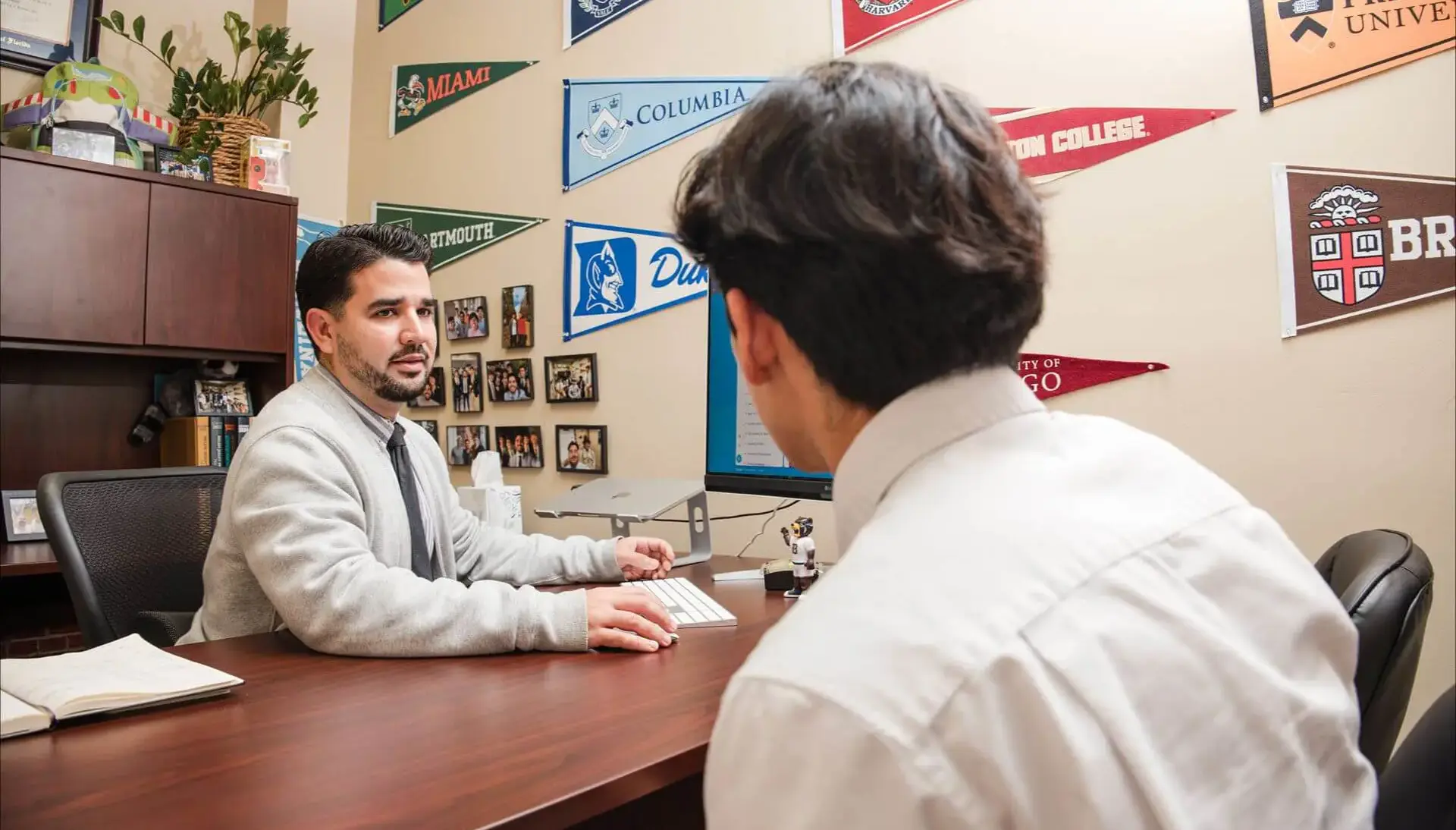 One of five dedicated College Counselors at Belen Jesuit goes over prospective universities with an upperclassman.