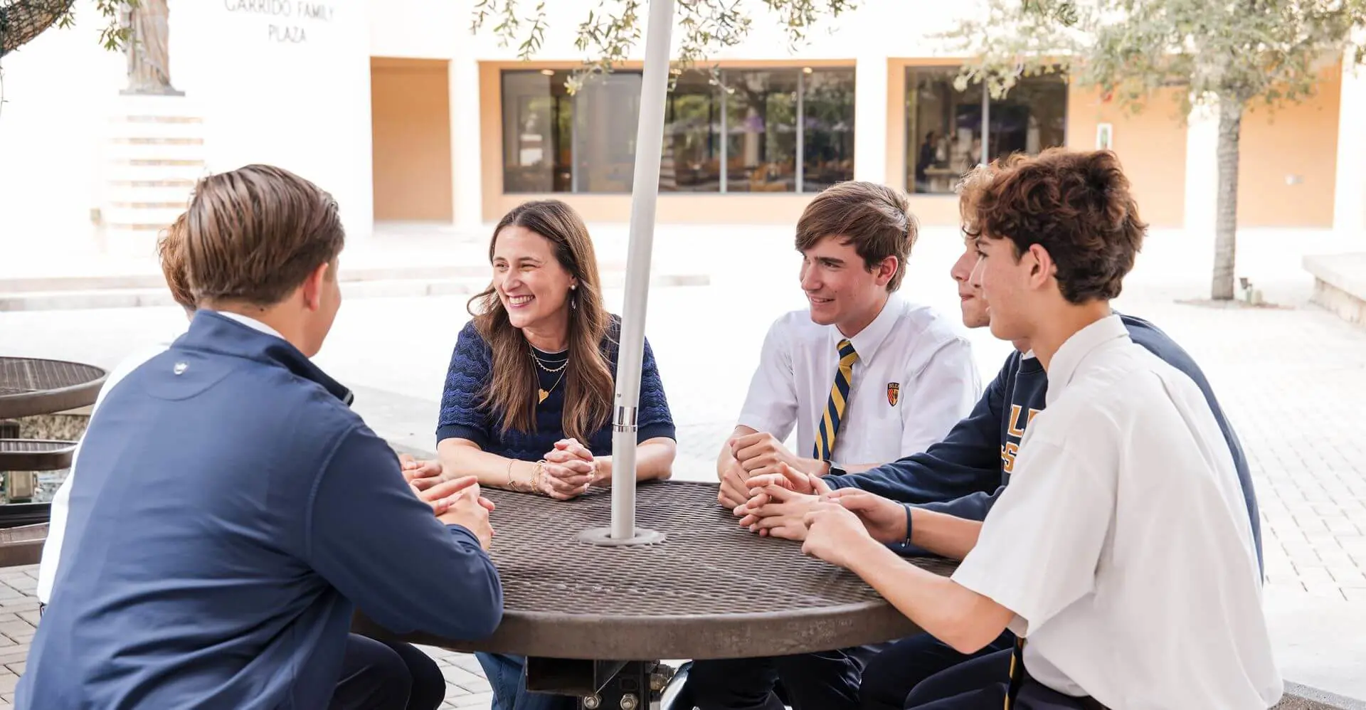 The Belen Jesuit faculty interacts with their students and offers guidance and support throughout the day.