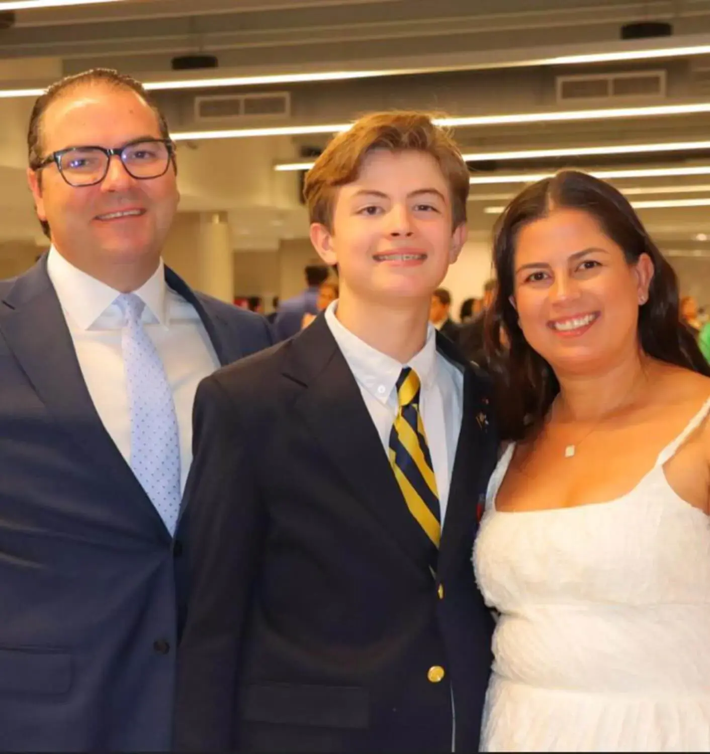 Michelle Menendez with her son, a student at Belen Jesuit.