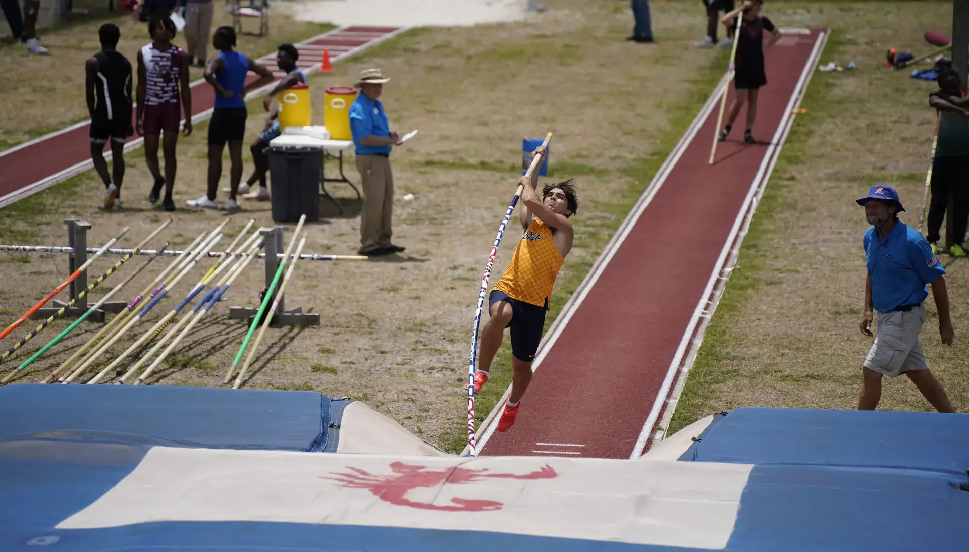 Belen Jesuit student athlete high jumping.