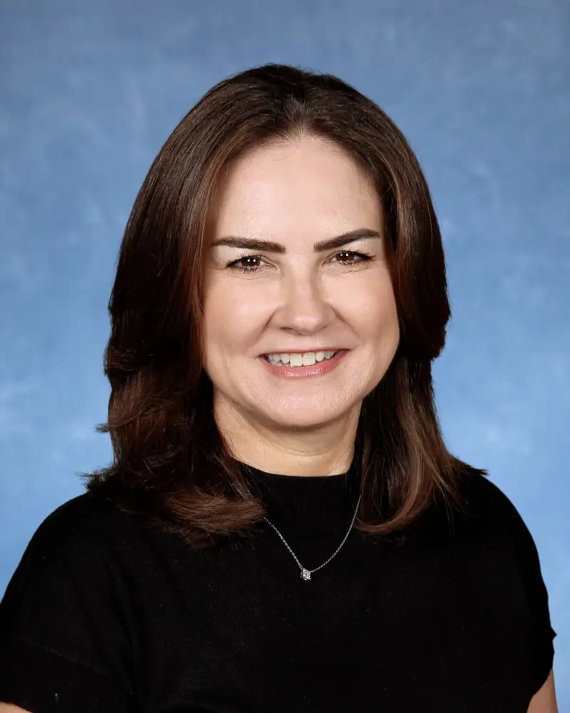 Yearbook pictures of Belen Jesuit Admissions Officer Mirna Menendez